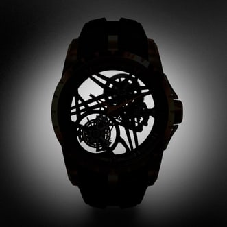 This image shows the Roger Dubuis Excalibur Monotourbillon RDDBEX0836 in a dark setting with only the skeleton and tourbillon visible.