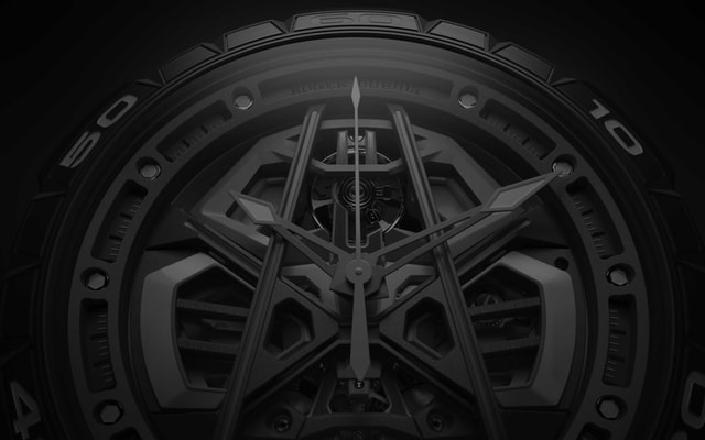 Roger Dubuis man holding a Lamborghini steering wheel