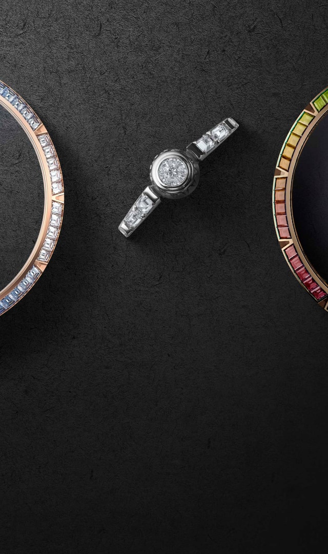 This image shows three bezels from different Roger Dubuis watch models, each set with different stones. There is also a white gold crown set with diamonds.